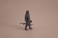 German WWII Fallschirmj�ger in winterdress with helmet and MG 42 - Image 1